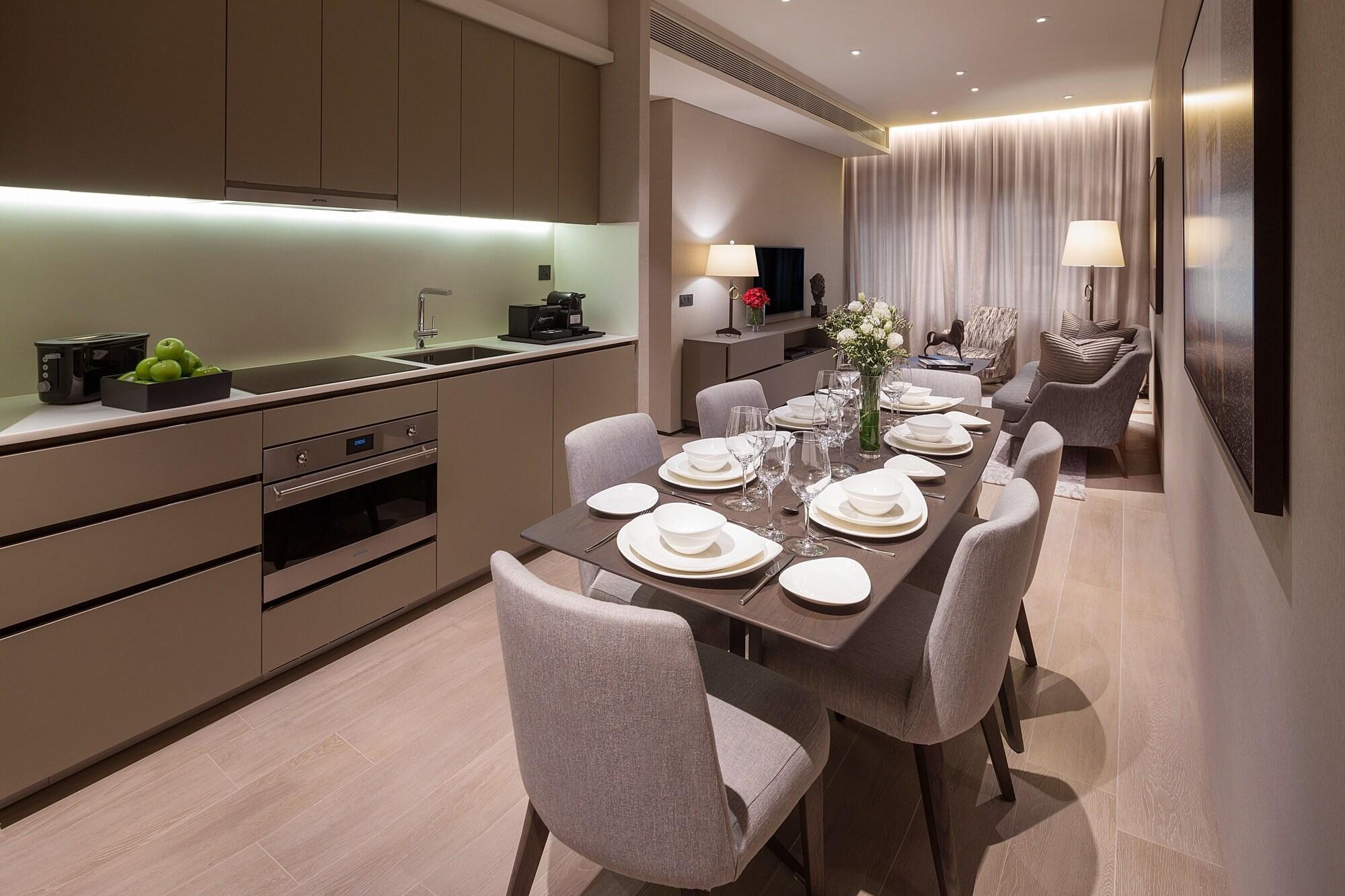 Dao By Dorsett Amtd Singapore Exterior photo The kitchen and dining area of a three-bedroom apartment